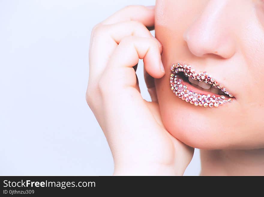 Woman With Gray Beaded Lipstick Close-up Photography