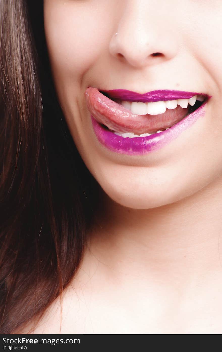 Woman Licking With Purple Lips