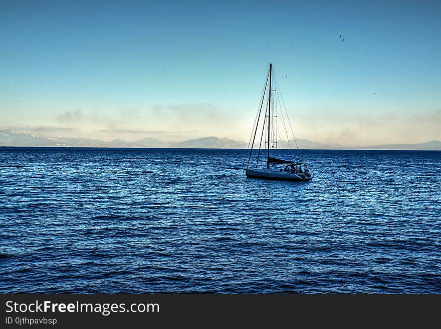 White Sailing Boat on Bodies of Water