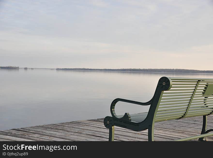 Photo of Gray Metal Bench Near Sea