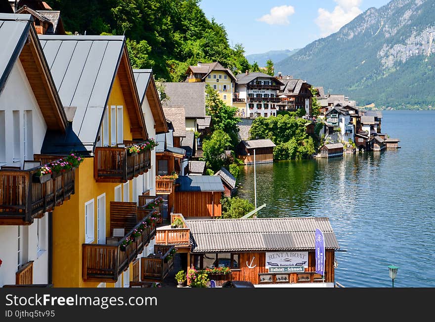 Photography of Houses Beside Body of Water