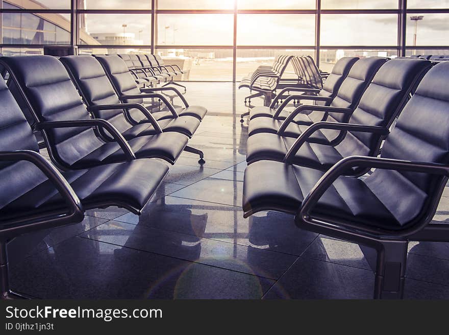 Seats In The Airport Waiting Room At Sunset. No One Is Sitting In The Airport.