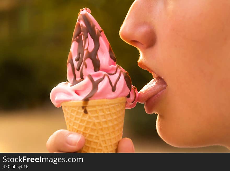 Young Teenage Girl Licking Ice Cream