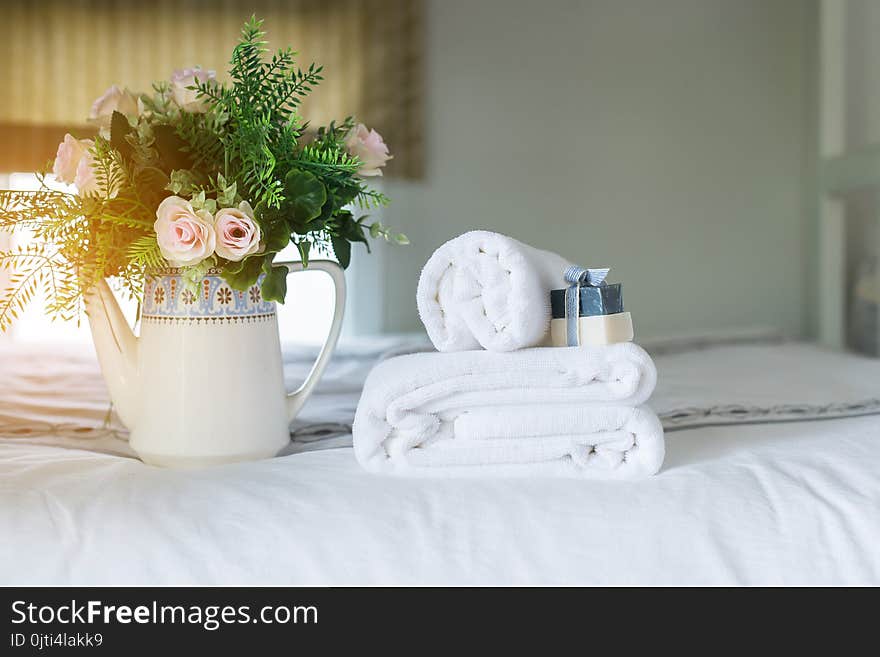 White hotel towel on bed in hotel ,Stack of fluffy bath towels. White hotel towel on bed in hotel ,Stack of fluffy bath towels