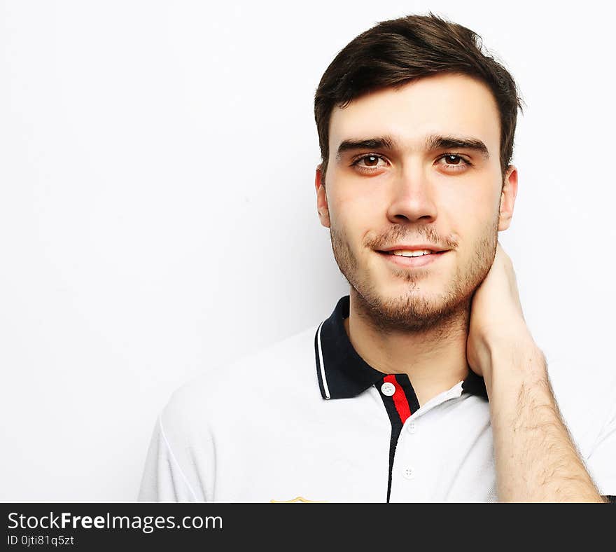 Lifestyle and people concept: handsome fashion man over white background