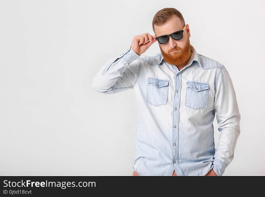 Beard man in sunglasses and denim shirt