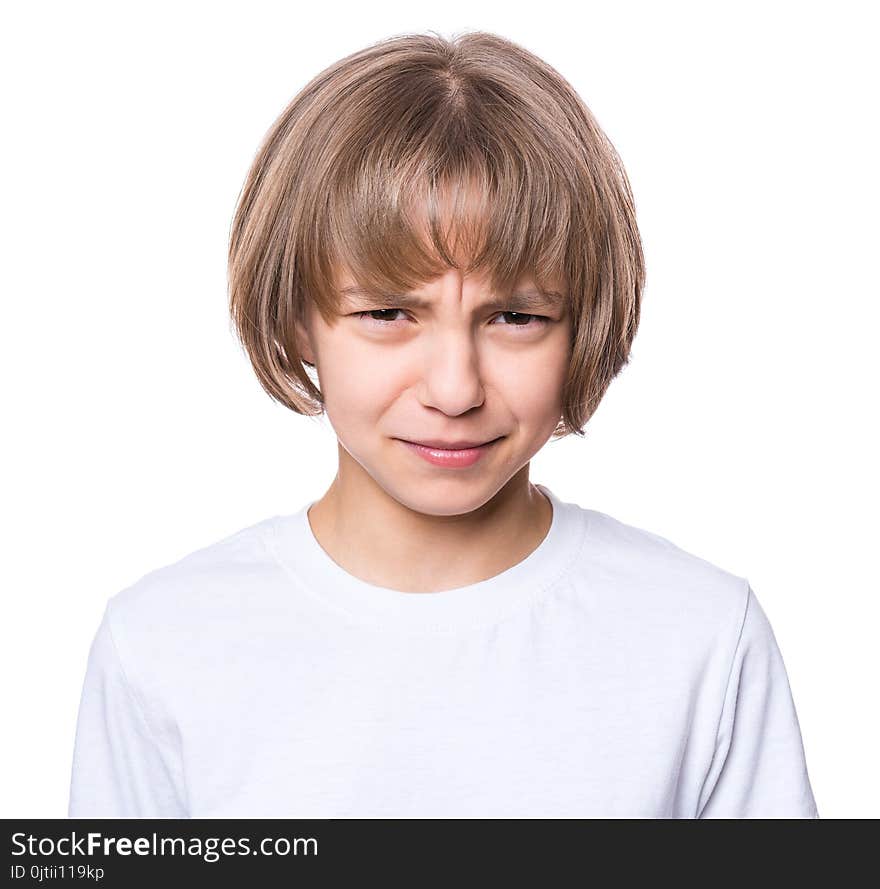 Portrait of sad attractive caucasian girl, isolated on white background. Unhappy schoolgirl looking at camera. Child in white t-shirt - emotional portrait close-up. Portrait of sad attractive caucasian girl, isolated on white background. Unhappy schoolgirl looking at camera. Child in white t-shirt - emotional portrait close-up.