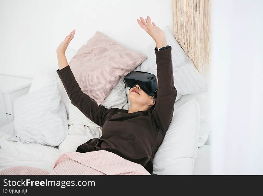 An Elderly Woman In Virtual Reality Glasses. An Elderly Person Using Modern Technology.