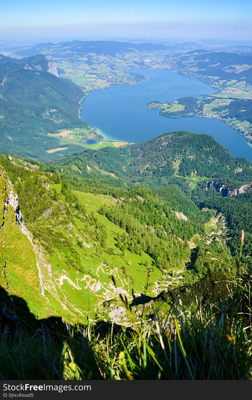 High Angle Photography of Green Grass and Tree Covered Mountain