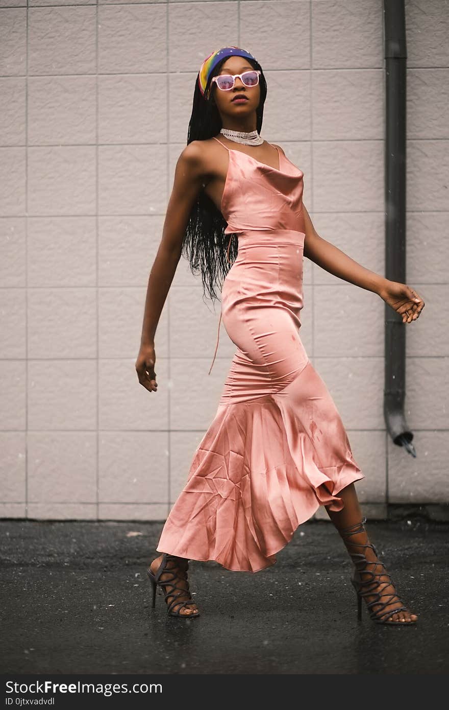 Photo of Woman in Pink Spaghetti Strap Top and Pink Long Skirt