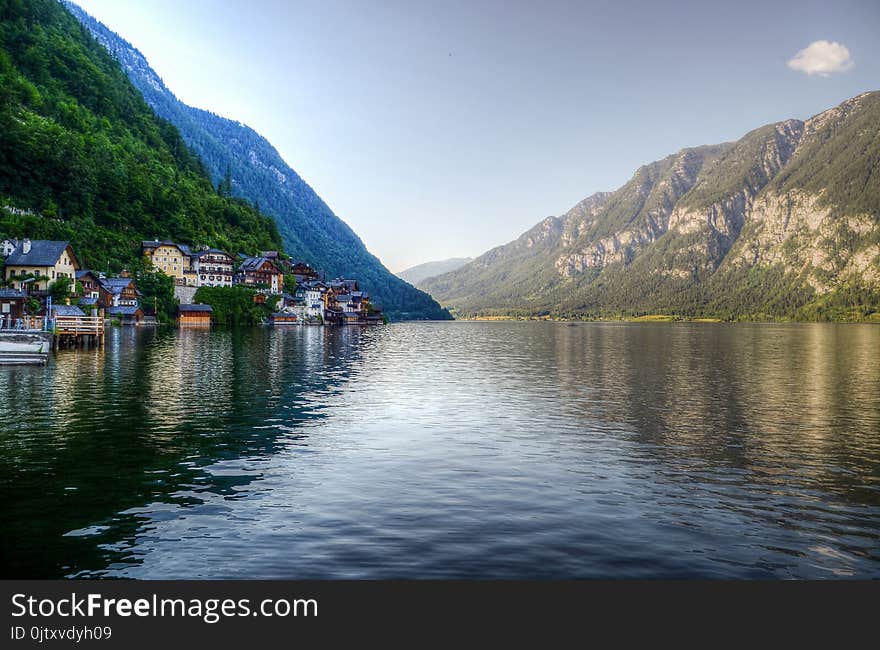 Photography of Body of Water Between Mountain