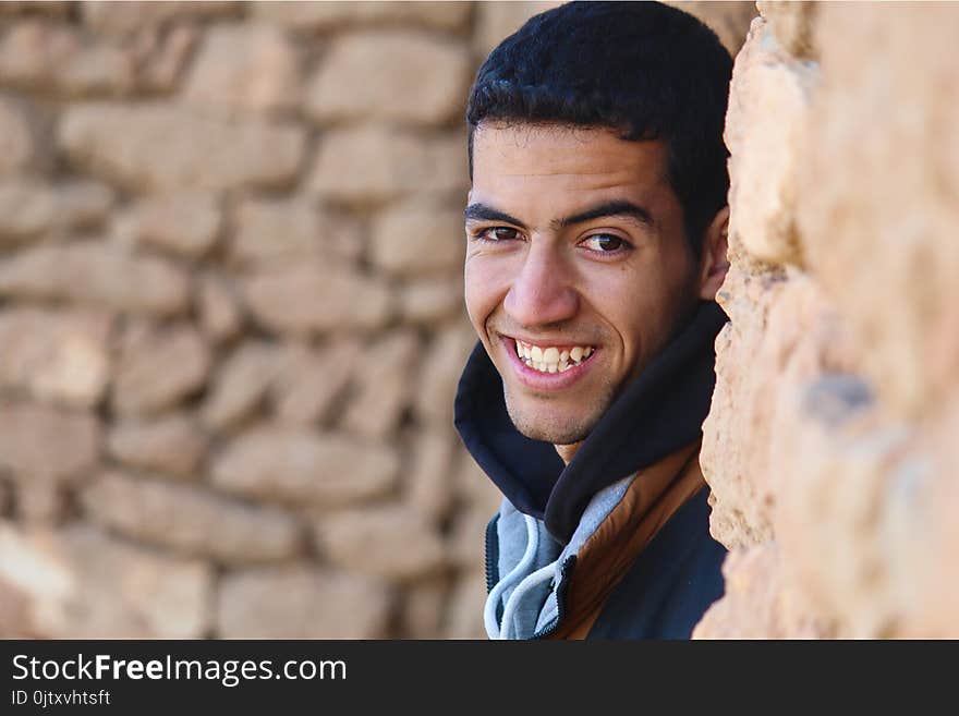 Photo Of Man Behind A Wall