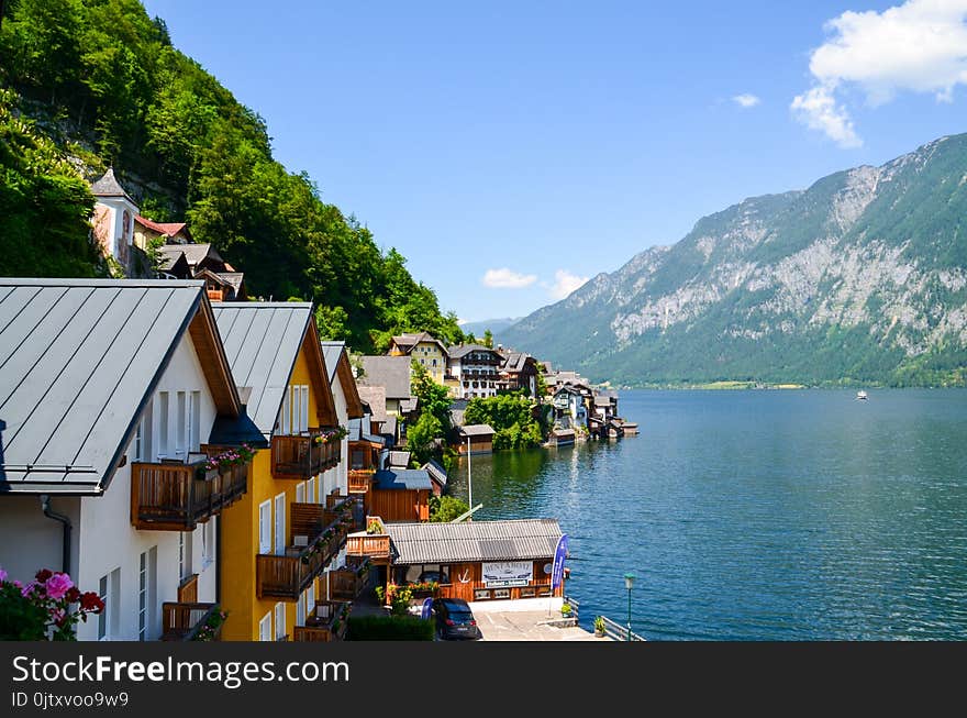 Photo Of Body of Water Beside Houses