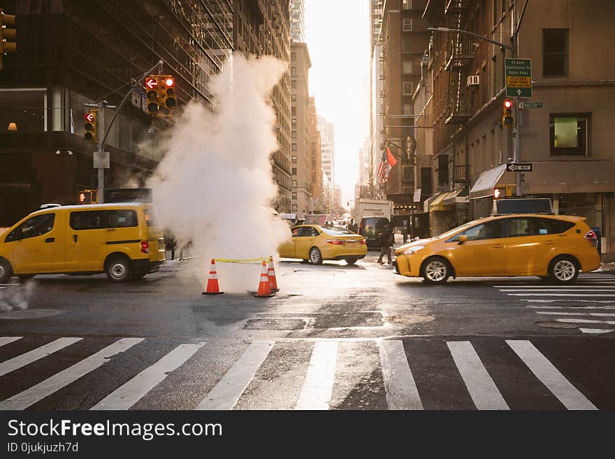 Manhattan morning sunrise view with yellow cabs passing in New York, United States