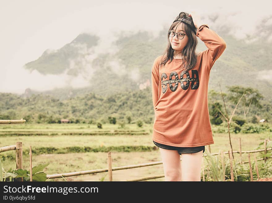 Woman Wearing Orange Long-sleeved Shirt