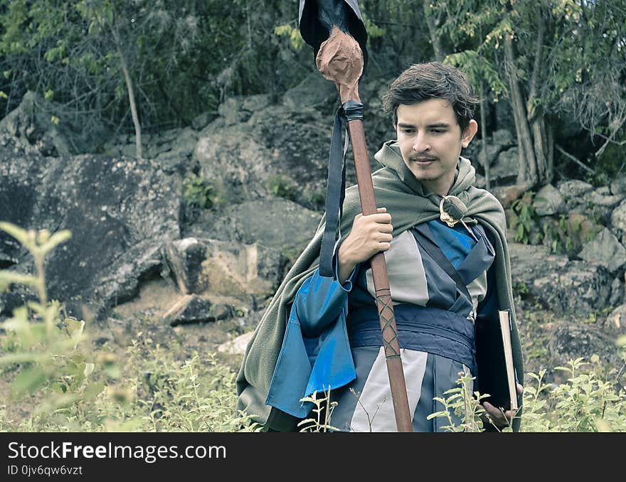 Man Holding Staff