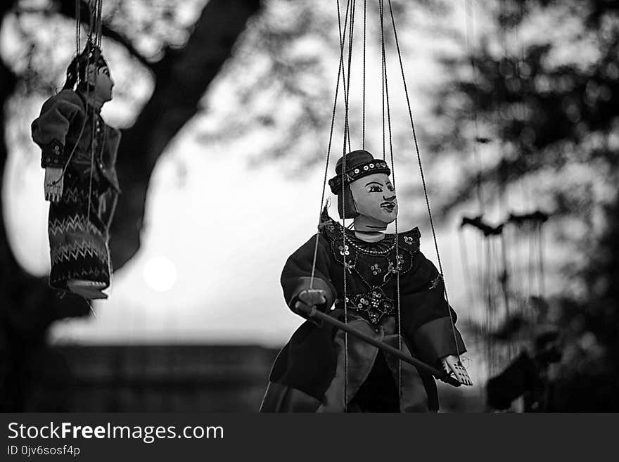 Grayscale of Two String Puppets