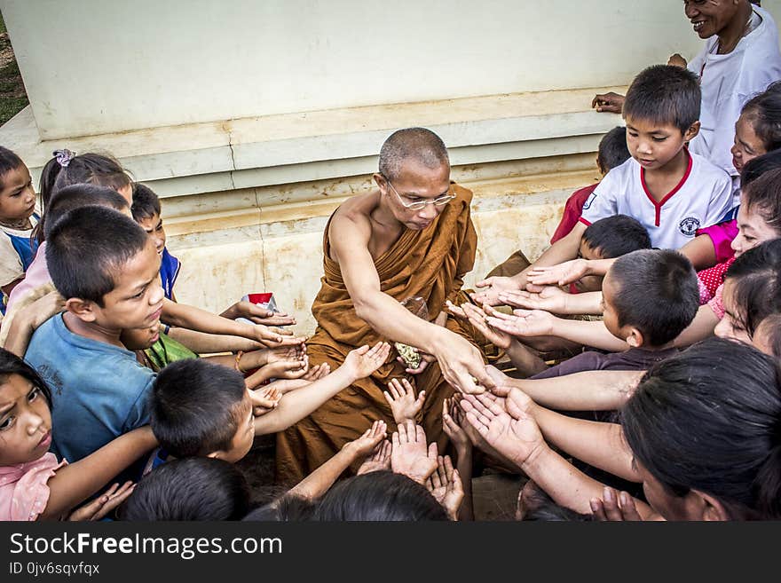 Group of People Lending Their Hands