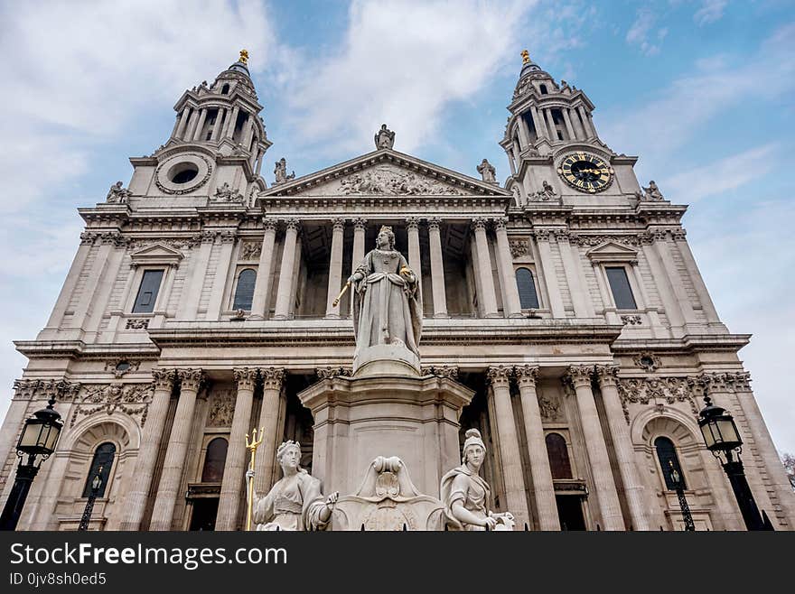 Saint Paul Cathedral and statue of Queen Anne in London, UK.