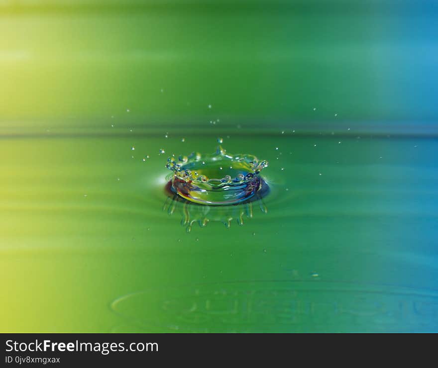 Waterdrop crown with colorful backgroun nikon d7100 18-105 lens close up. Waterdrop crown with colorful backgroun nikon d7100 18-105 lens close up