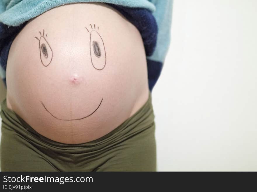 Funny faces on a belly