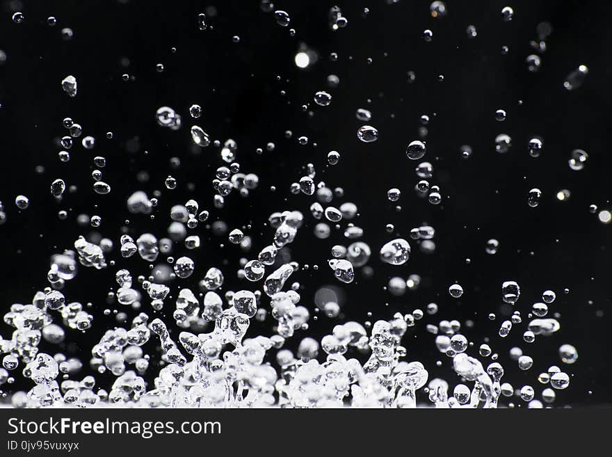 Drops of water frozen in flight upwards. Drops of water frozen in flight upwards