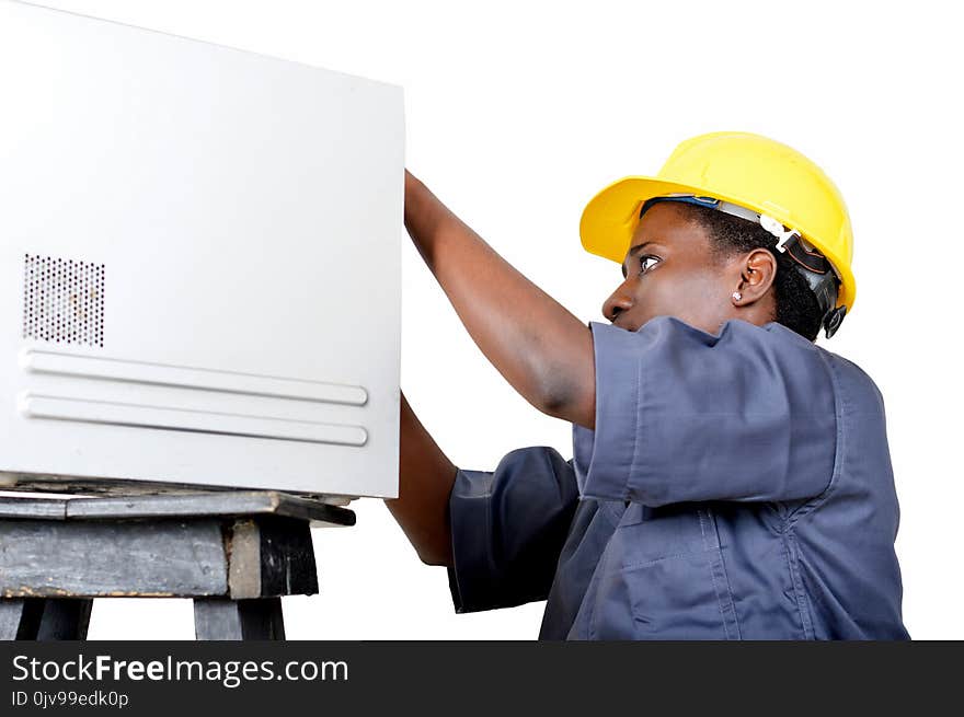 Portrait of young woman in computer maintenance.