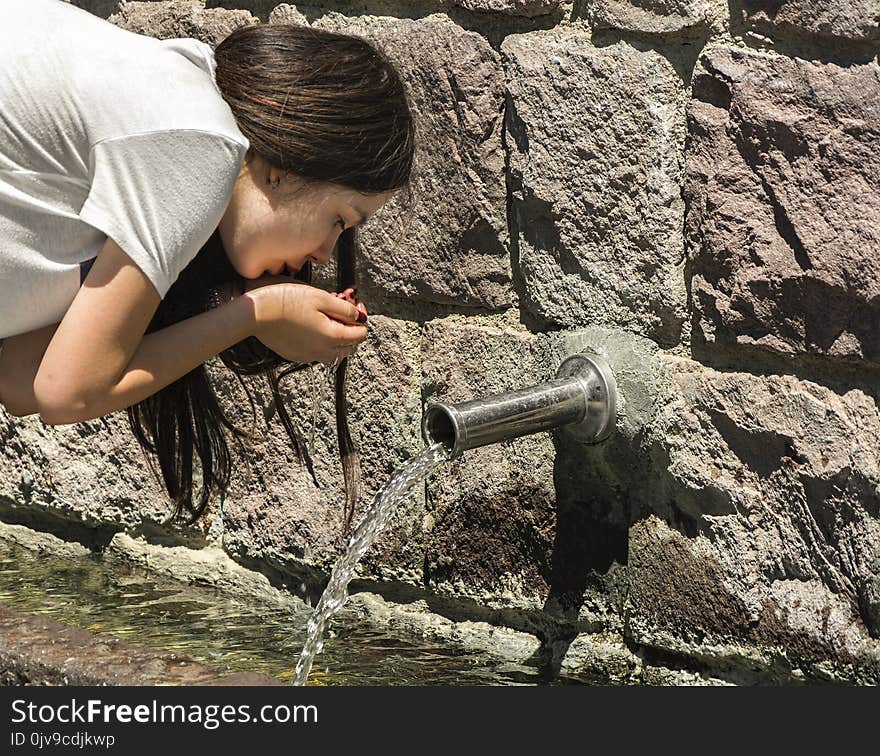 Young Girl Drinking Old Water