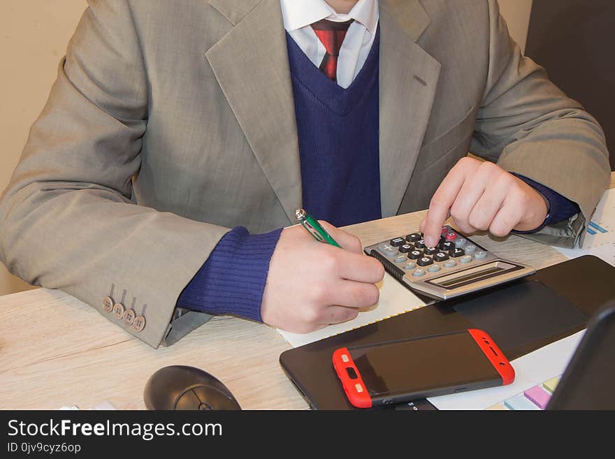 Administrator financial inspector and secretary making report, calculating or check balance. Internal Revenue Service inspector checking document. Hands of accountant with pen. Administrator financial inspector and secretary making report, calculating or check balance. Internal Revenue Service inspector checking document. Hands of accountant with pen