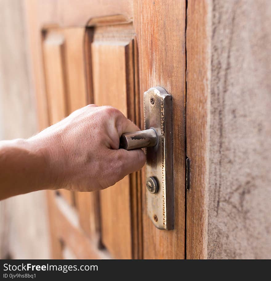 Opening the doors of the old hand .