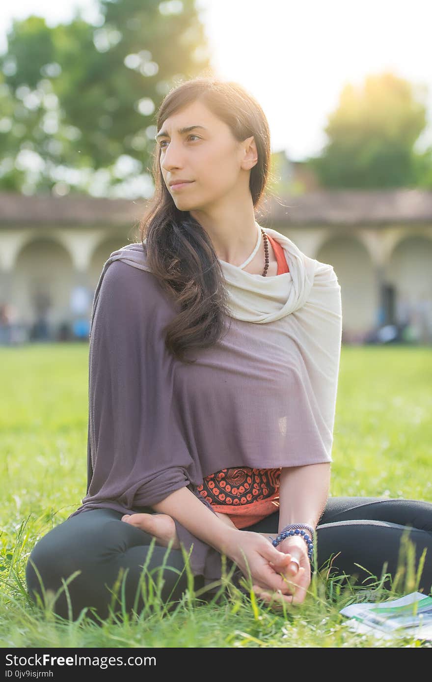 Student girl sitting in the school lawn