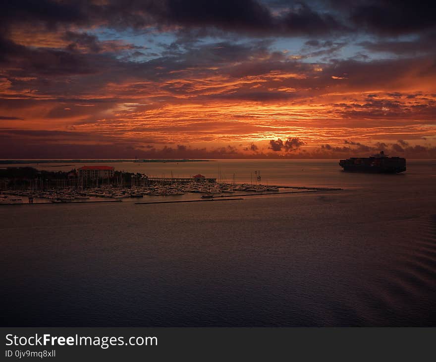 Big container vessel at sunset