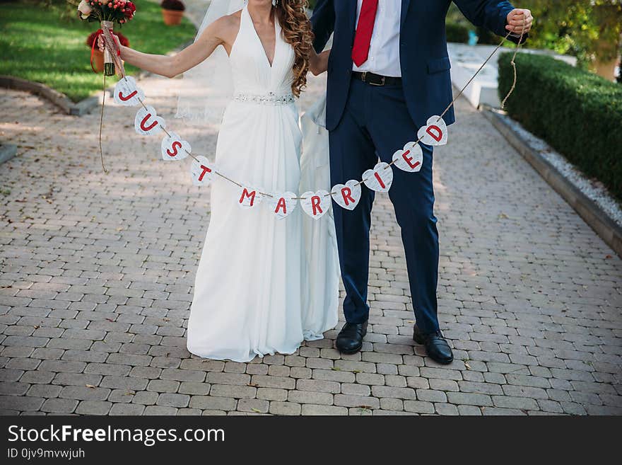 Beautiful wedding inscription just married. Close-up beauty placard. Bridal and groom accessories. Details for marriage