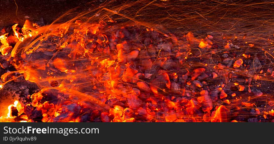 Burning charcoal as background . Photo of an abstract texture