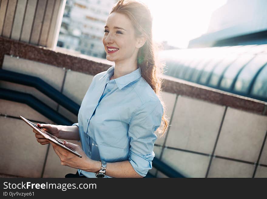 Portrait of successful business woman smiling outdoor. Portrait of successful business woman smiling outdoor