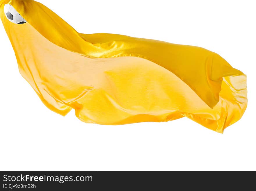 Soccer ball and Smooth elegant transparent yellow cloth isolated or separated on white studio background. Texture of flying fabric. yellow. Attributes of popular game. Concept of national flag color