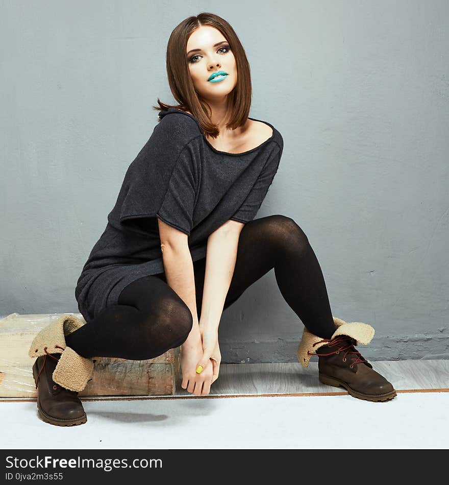 Fashion woman model sitting. Grunge