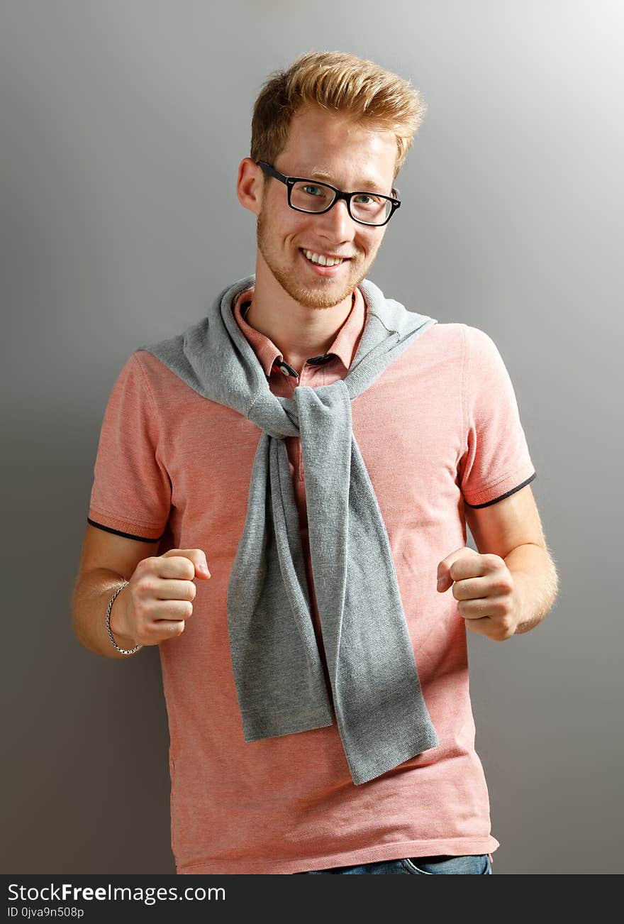 Young Man On Grey Background.