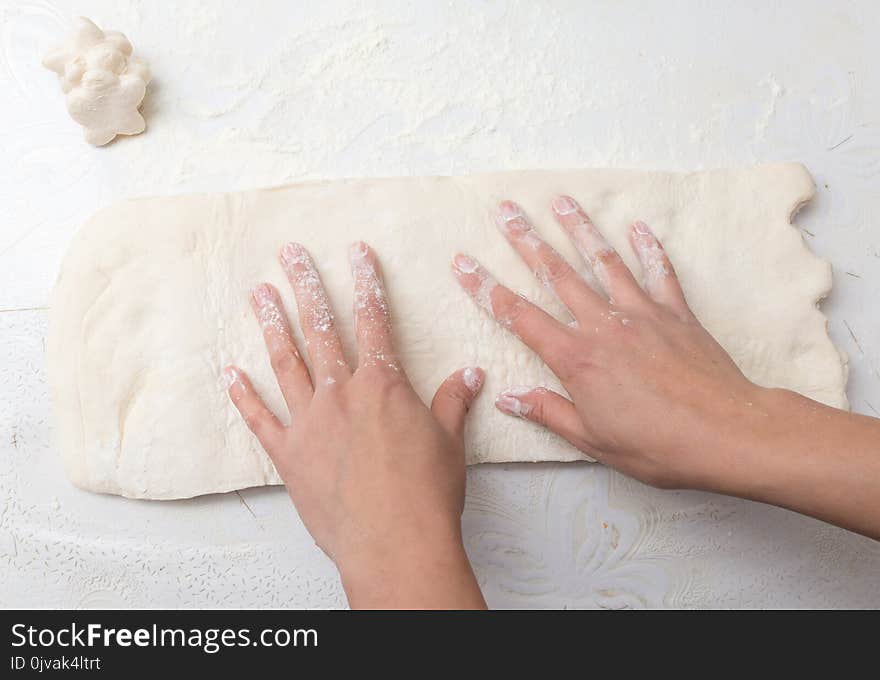 Rolling The Dough In The Kitchen