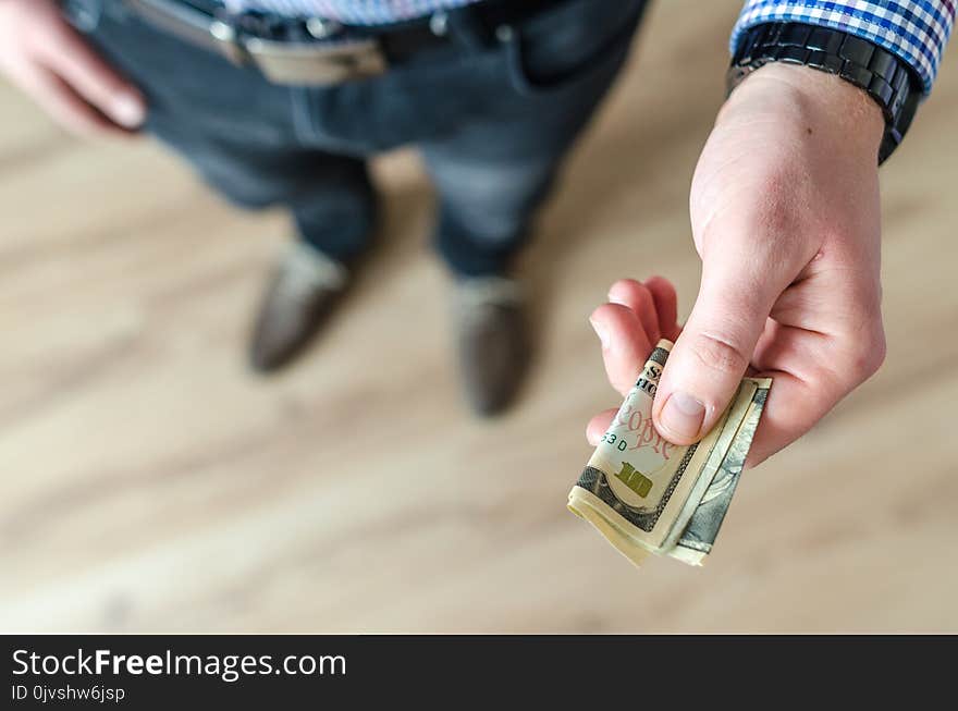 Person Holding Banknote