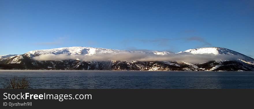 Landscape Photography of Mountain Near Body of Water