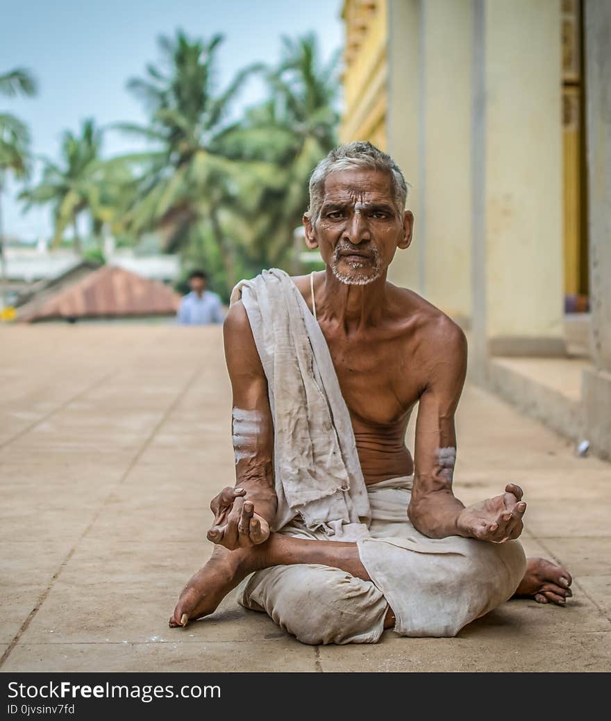 Man Meditating at Daytime