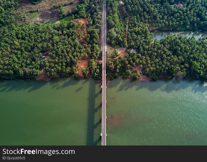 Aerial Photography of Gray Bridge over Body of Water