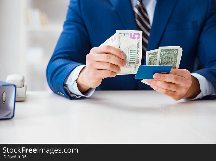 The Businessman Holding Dollar Money And Credit Card