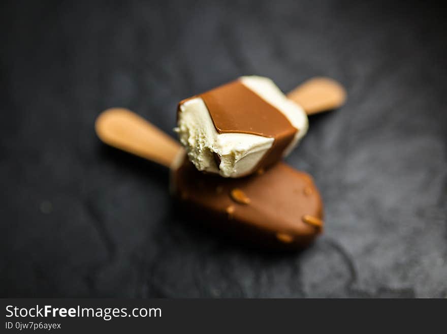 Ice cream on a stick on dark slate background