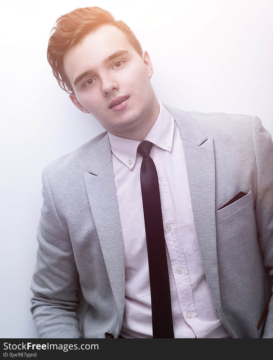 Closeup of a young man in a business suit.