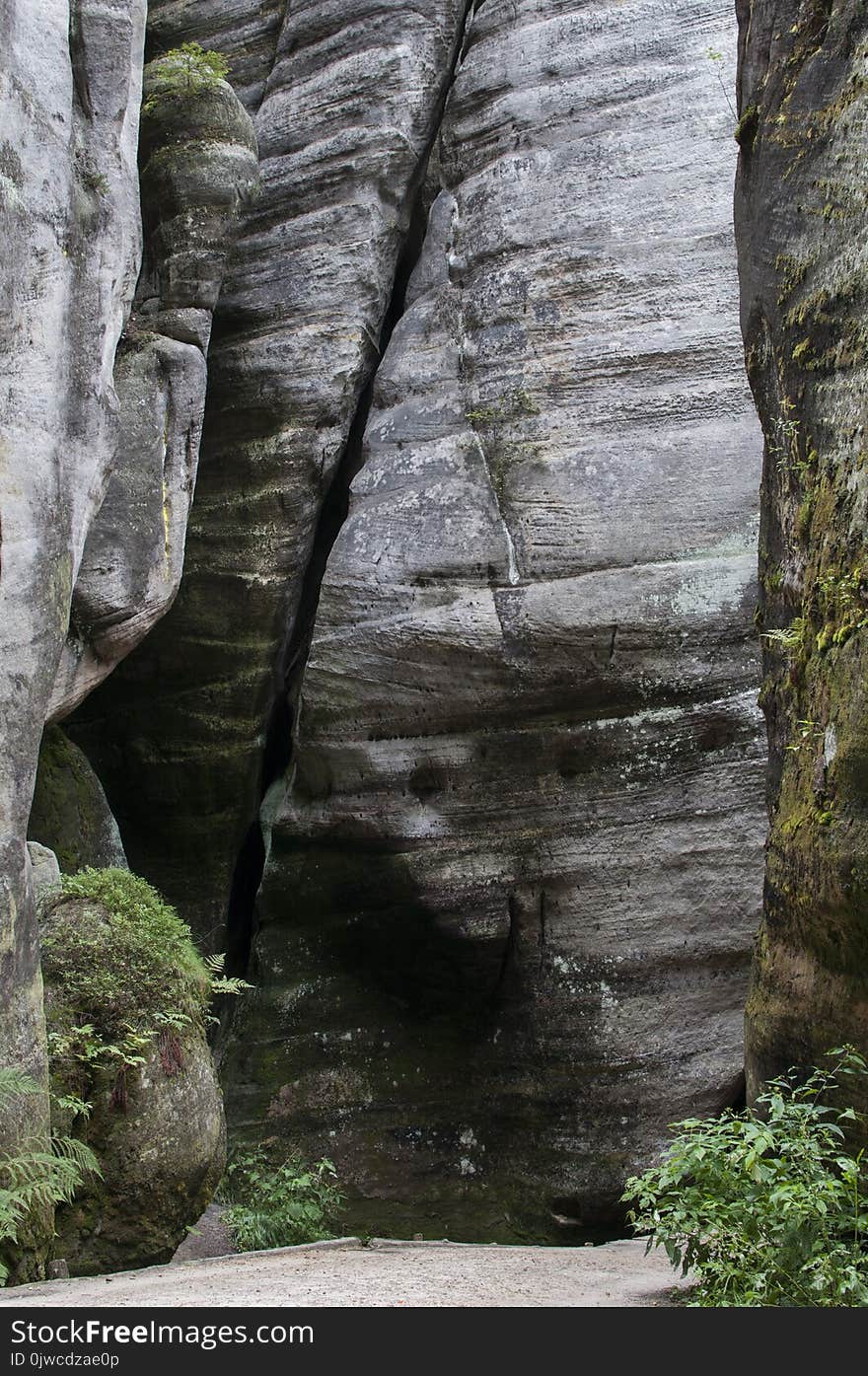 The narrow path among high rocks Adrspach Rock City during summer