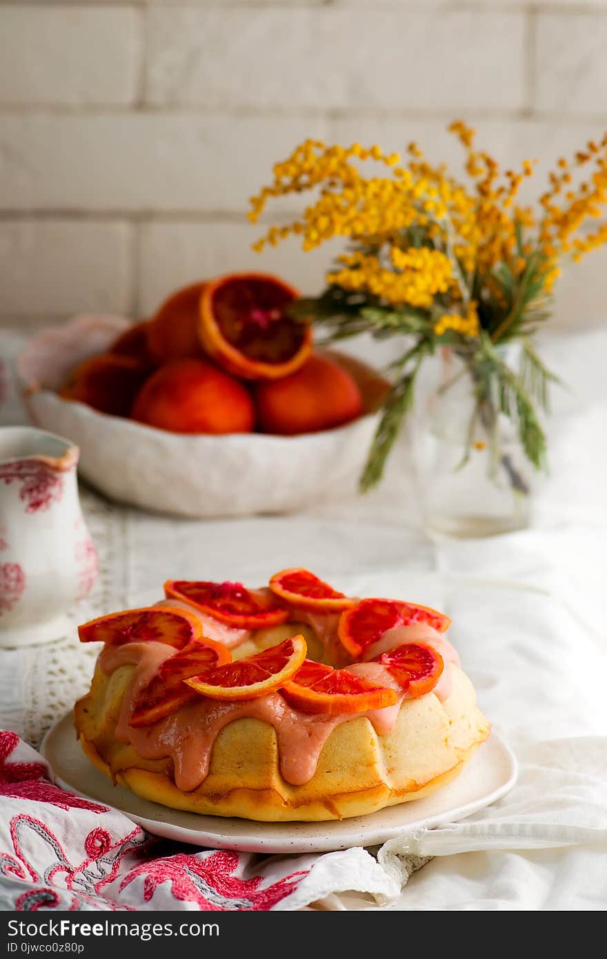 BLOOD ORANGE POUND CAKE WITH AN ORANGE ZEST ICING..vintage style.selective focus