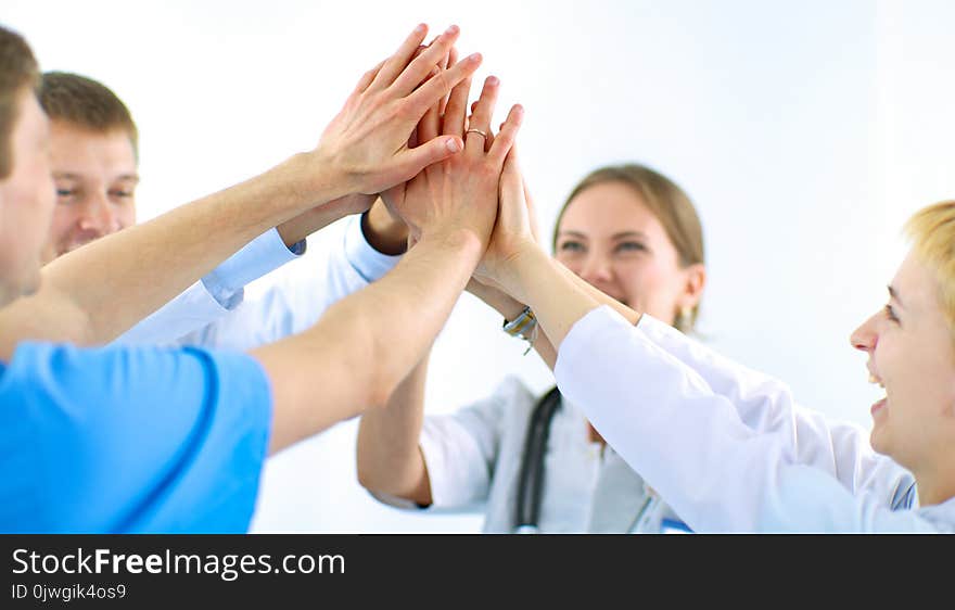 Doctors And Nurses In A Medical Team Stacking Hands