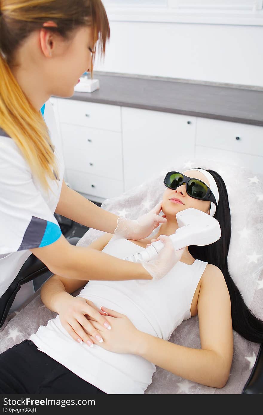 Body Care. Woman Receiving Face Skin Analysis. Cosmetology.